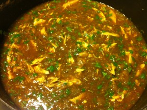 Adding the chicken, cilantro, and lime juice.