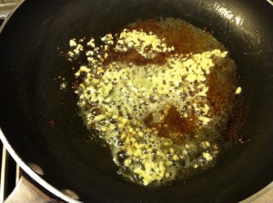 Cooking the garlic. Be sure not to let it become too brown.