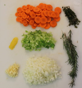 The produce: Starting from top left - lemon zest, garlic; middle, from top - carrots, celery, onion; right, from top - thyme, rosemary