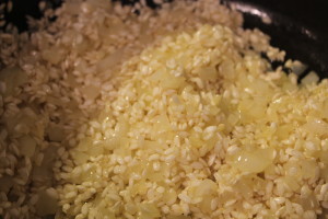Adding the rice. This will help to flavor the rice and begin the cooking process.