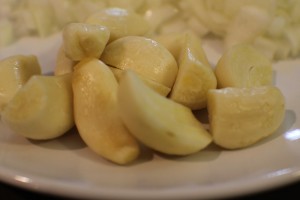 If your garlic cloves are large, cut them down to make the cloves more equal in size.