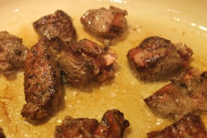 Browning the meat. Don't crowd the pan or instead of a nice brown crust, you'll end up with grayed steamed meat.
